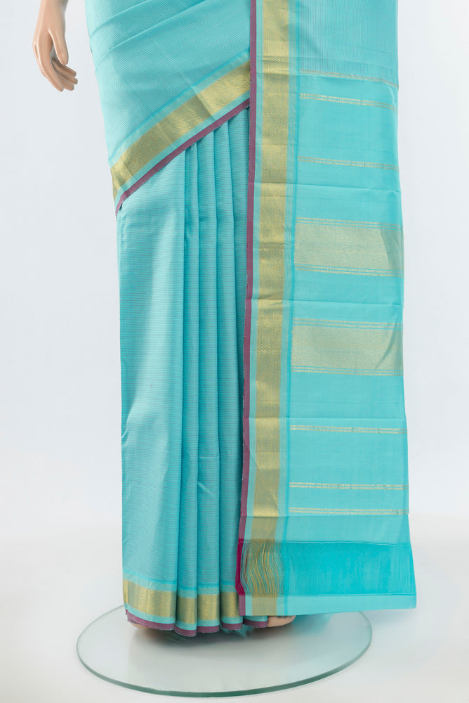 Pleats and pallu of Pure Silk Pure Zari Sky Blue Kanchipuram Saree with Zari Butta on the body and Silk Border. 