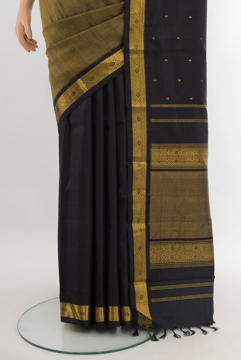 Pleats and pallu of Black Kanjivaram Silk Saree with Half And Half on the body and Zari Border. 