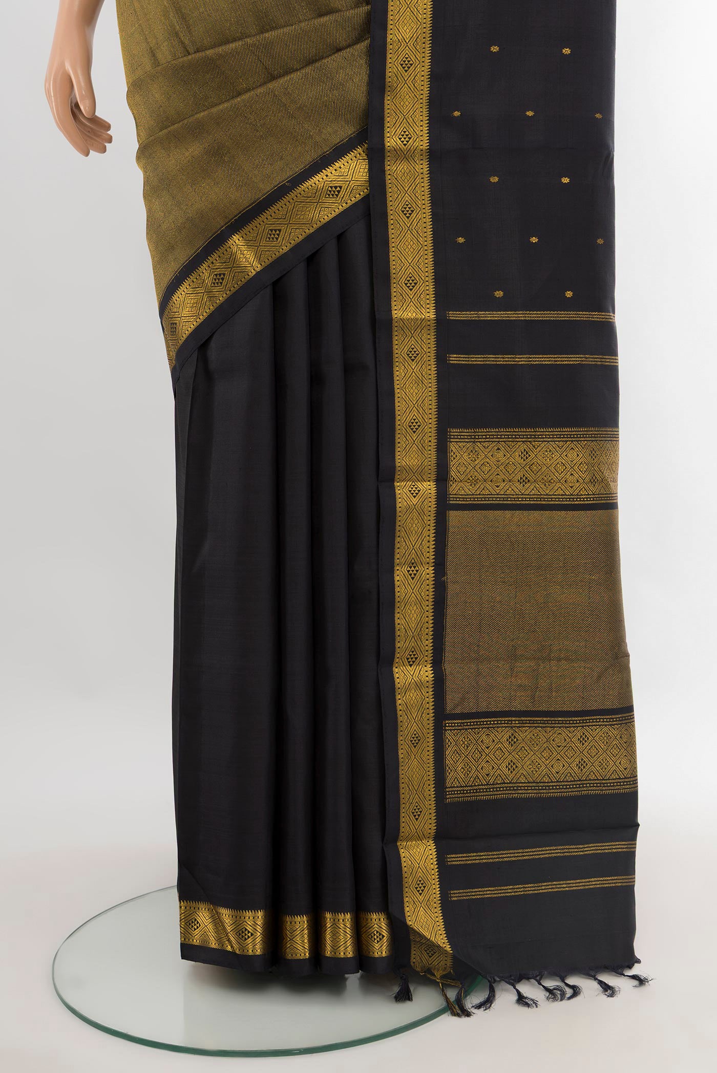 Pleats and pallu of Black Kanjivaram Silk Saree with Half And Half on the body and Zari Border. 