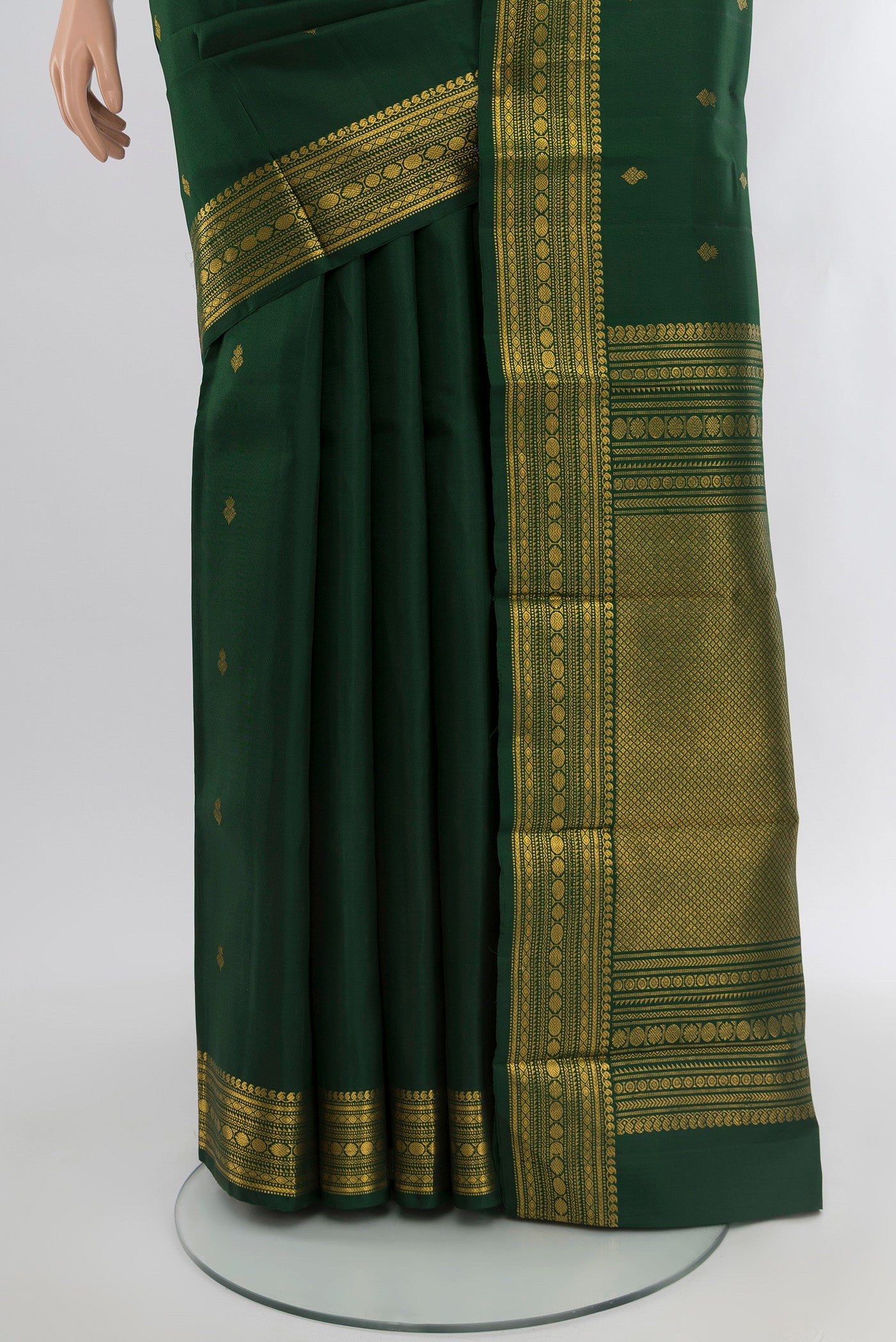 Pleats and pallu of Bottle Green Kanjivaram Silk Saree with Zari Butta on the body and Zari Border. 