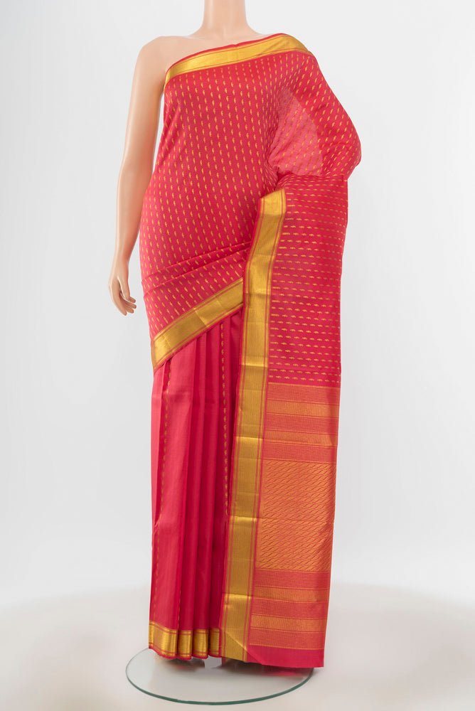 Pure Silk Pure Zari Peach Kanjivaram Saree with Zari Butta on the body and Silk Border.  displayed on a mannequin