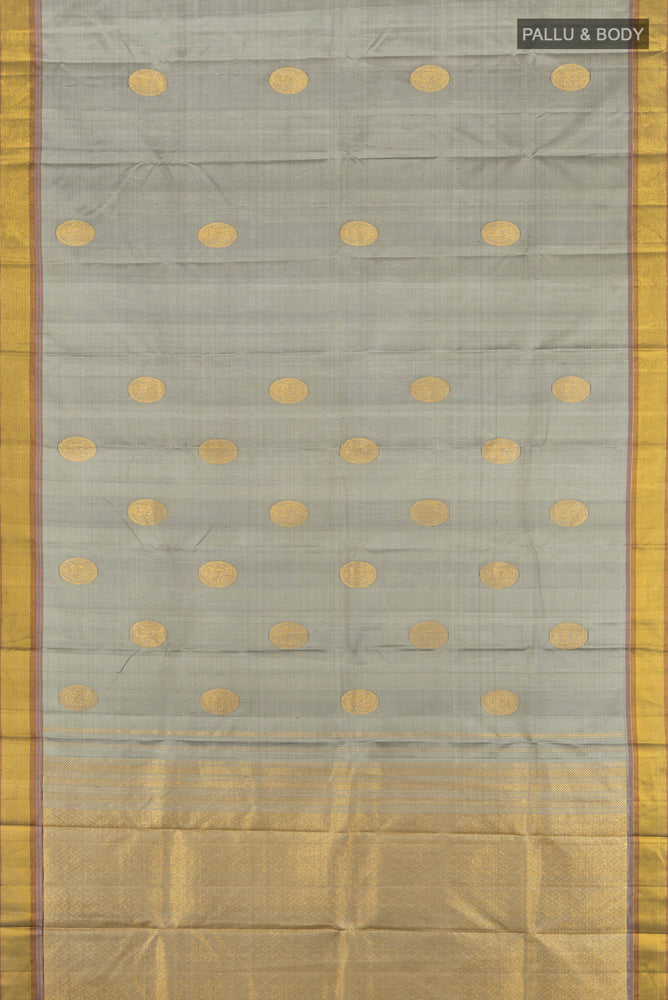 Flat view of Pure Silk Pure Zari Davys Grey Kanjivaram Saree with Zari Butta on the body and Silk Border. 