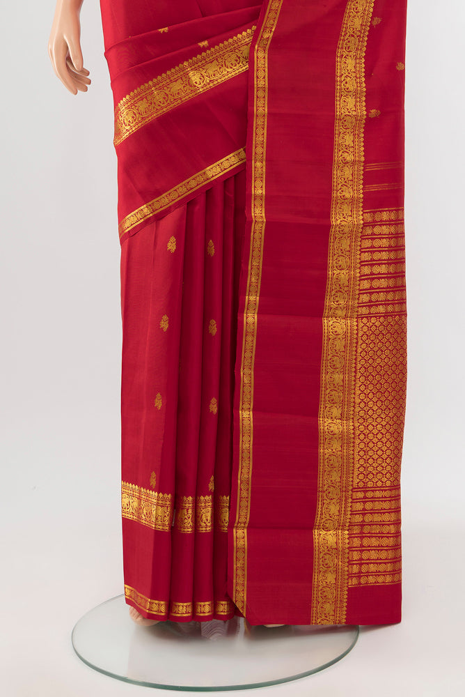 Pleats and pallu of Red Kanjivaram Silk Saree with Zari Butta on the body and Silk Border. 