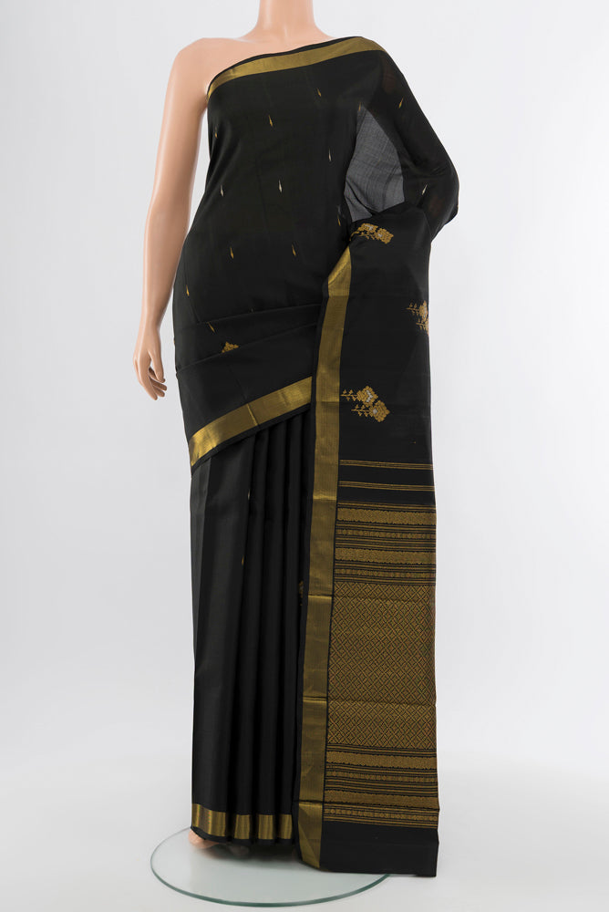 Black Kanjivaram Silk Saree with Zari Butta on the body and Silk Border.  displayed on a mannequin