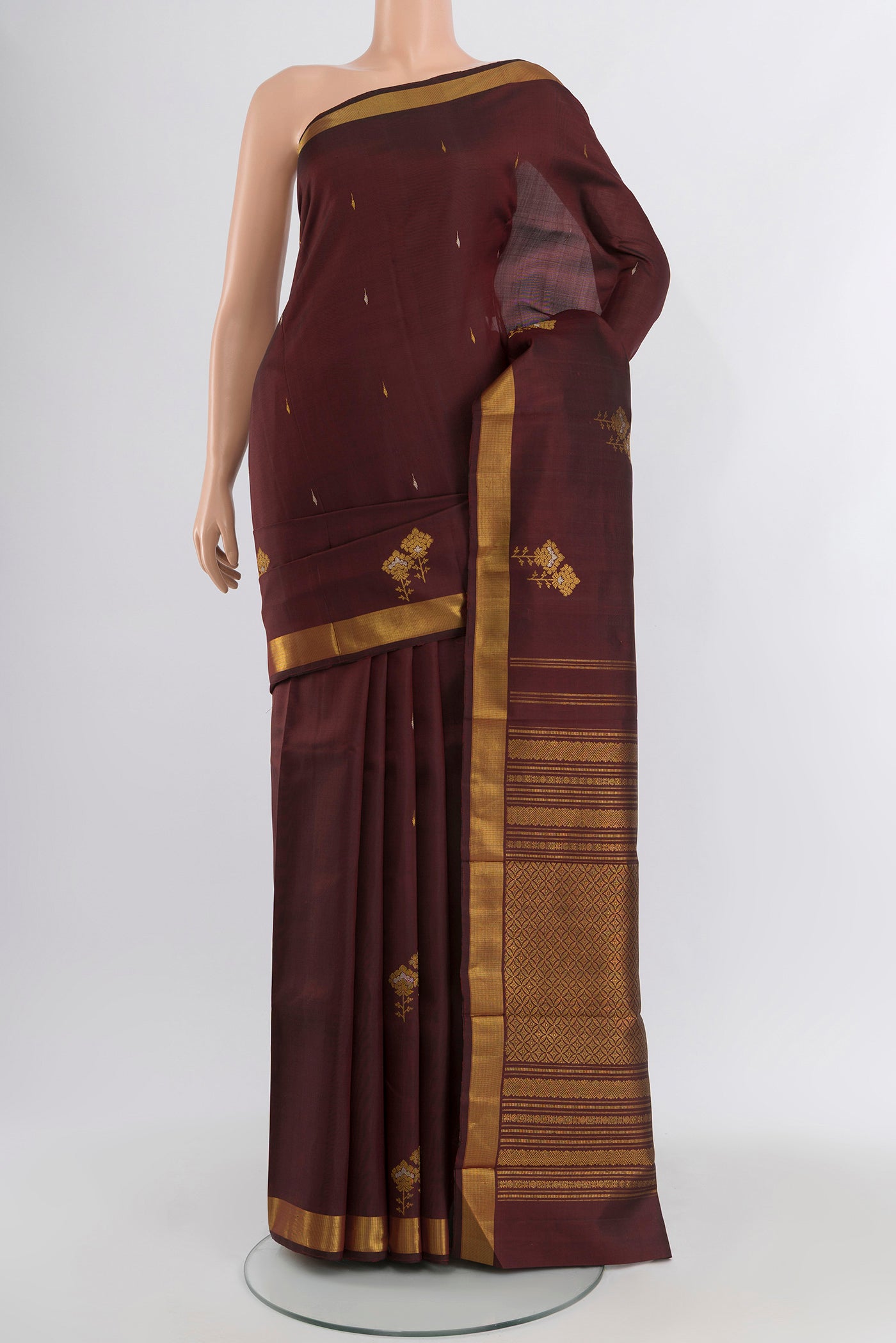 Coffee Brown Kanjivaram Silk Saree with Zari Butta on the body and Zari Border.  displayed on a mannequin