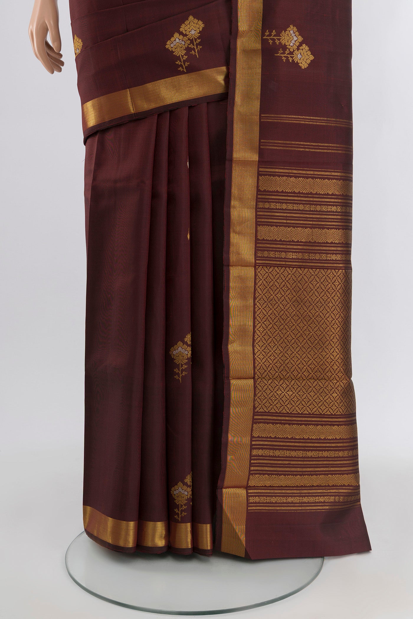 Pleats and pallu of Coffee Brown Kanjivaram Silk Saree with Zari Butta on the body and Zari Border. 