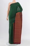 Pure Silk Pure Zari Bottle Green Kanjivaram Saree with Zari Butta on the body and Silk Border.  displayed on a mannequin