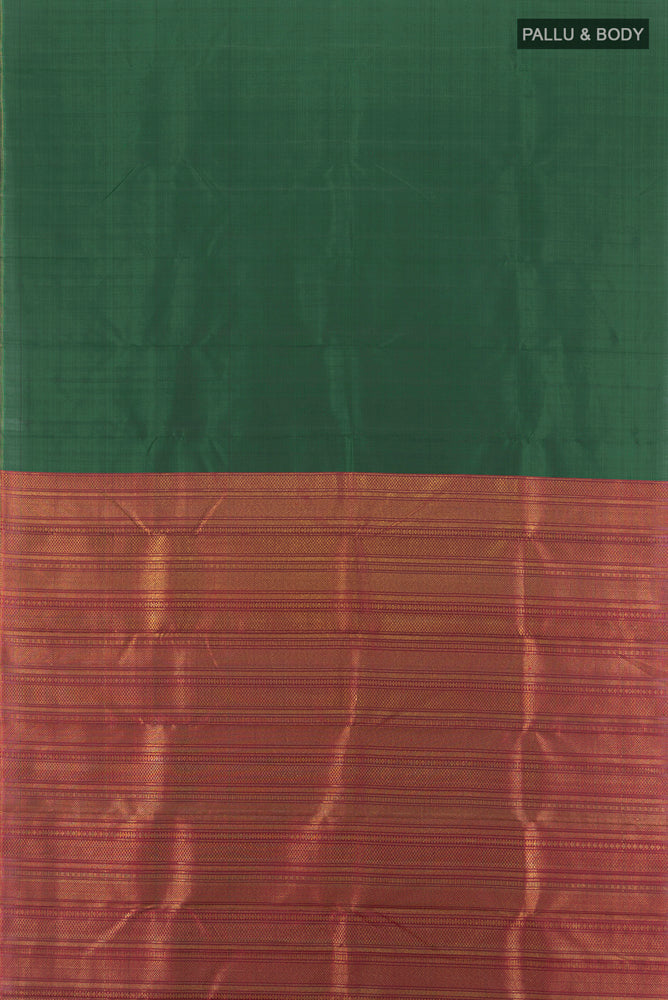 Flat view of Pure Silk Pure Zari Bottle Green Kanjivaram Saree with Zari Butta on the body and Silk Border. 