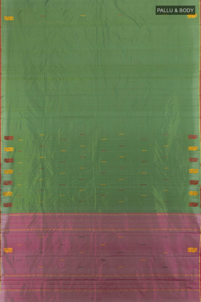 Flat view of Light Green Kanchipuram Silk Saree with Plain Body and Zari Border. 