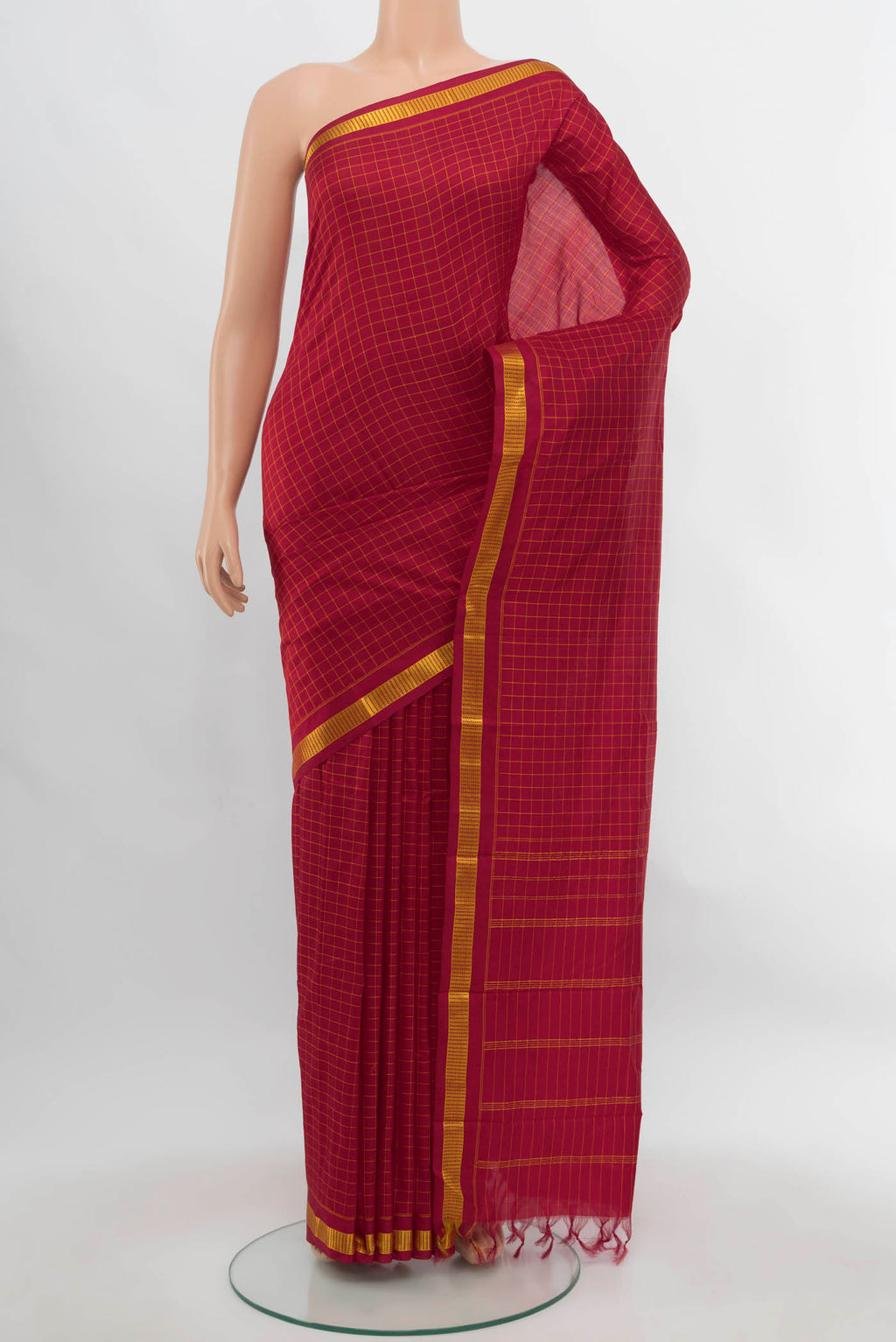 Maroon Kanchipuram Silk Saree with Checked design on the body and Silk Border.  displayed on a mannequin