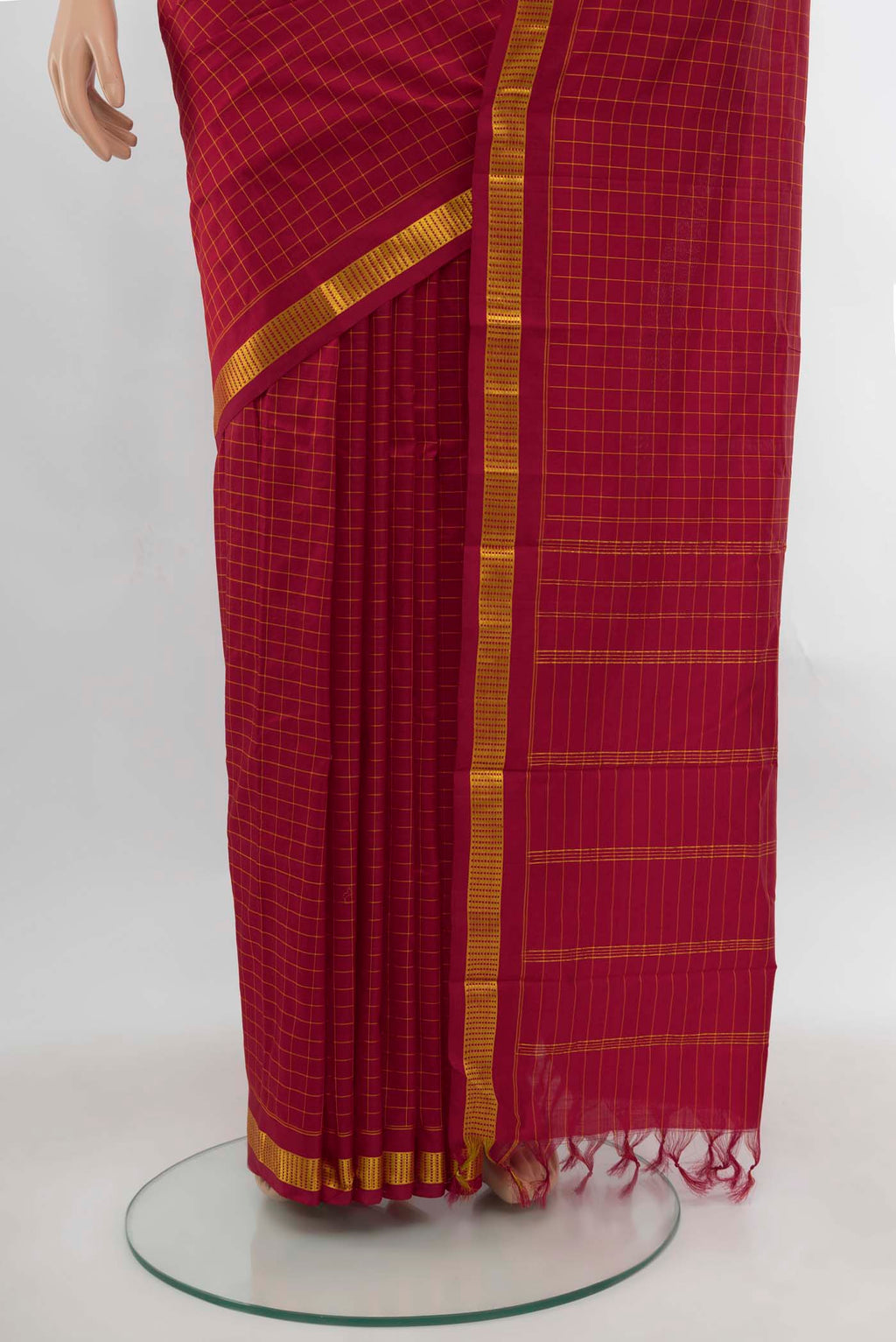 Pleats and pallu of Maroon Kanchipuram Silk Saree with Checked design on the body and Silk Border. 