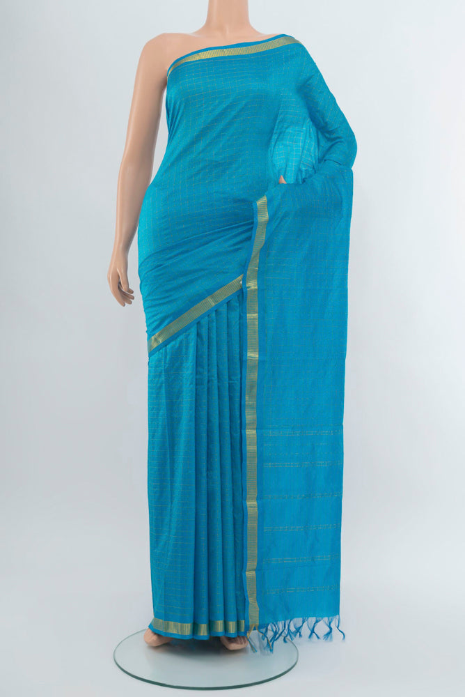 Light Blue Kanchipuram Silk Saree with Checked design on the body and Zari Border.  displayed on a mannequin