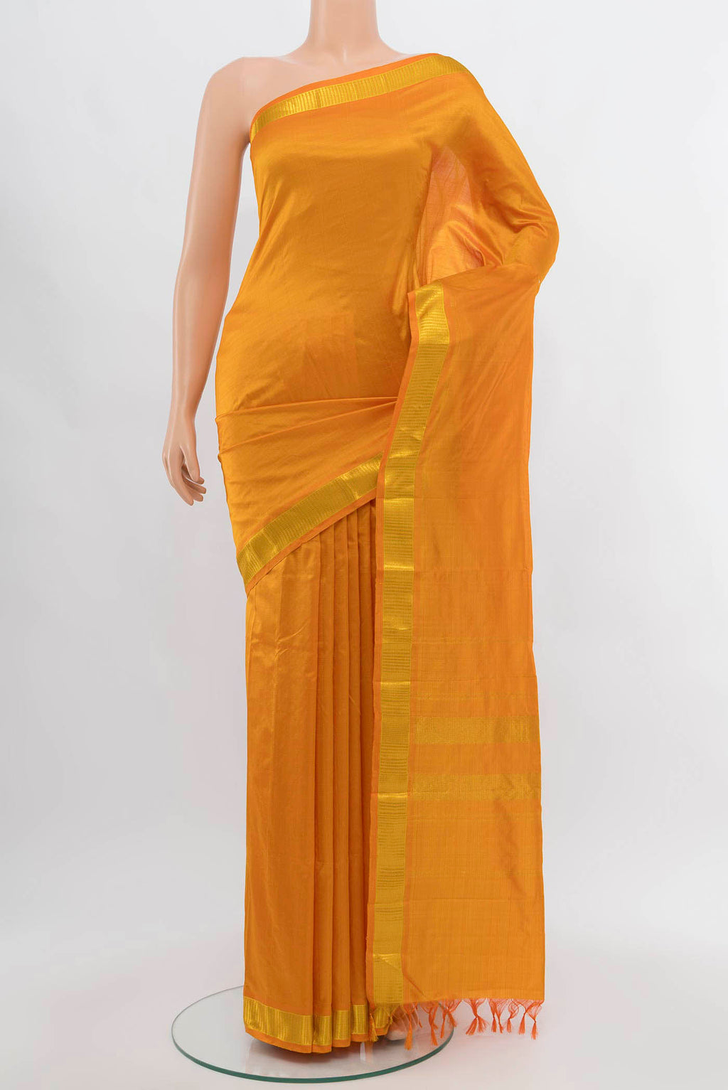 Orange Kanchipuram Silk Saree with Plain Body and Silk Border displayed on a mannequin