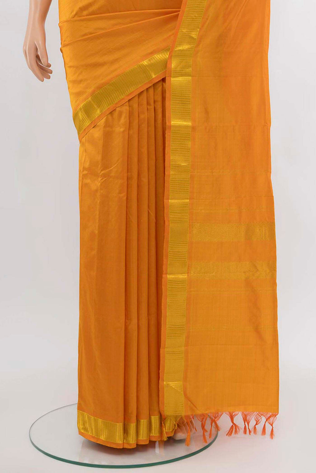 Pleats and pallu of Orange Kanchipuram Silk Saree with Plain Body and Silk Border