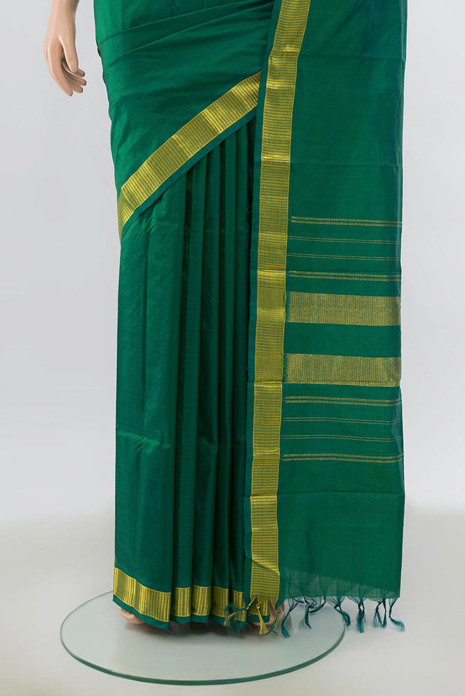 Pleats and pallu of Mint Green Kanjivaram Silk Saree with Zari Butta on the body and Silk Border. 