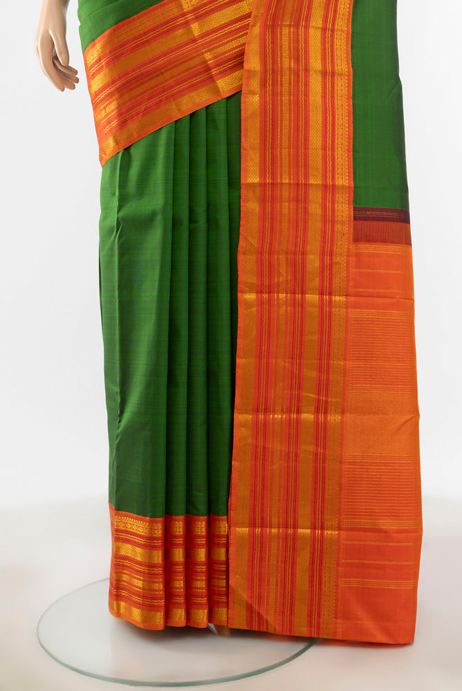 Pleats and pallu of Mint Green Kanjivaram Silk Saree with Zari Butta on the body and Silk Border. 