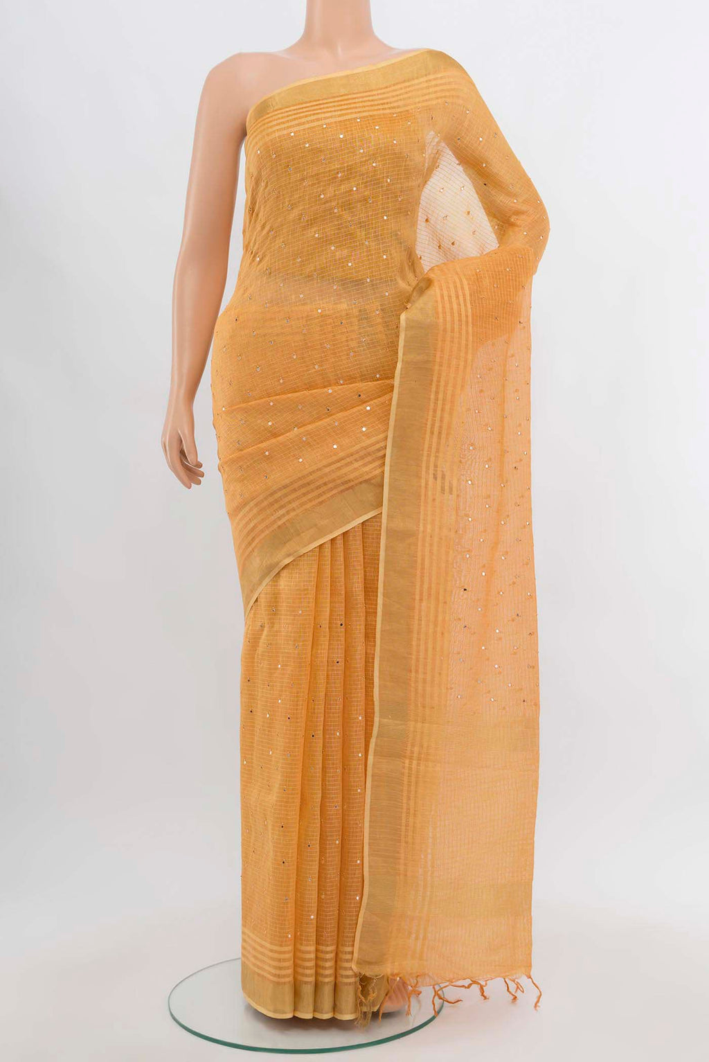 Brick Orange Kora Cotton Saree with Zari Butta on the body and Silk Border displayed on a mannequin
