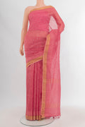 Rose pink Tussar Silk Saree with Embroidery on the body and Zari Border.  displayed on a mannequin
