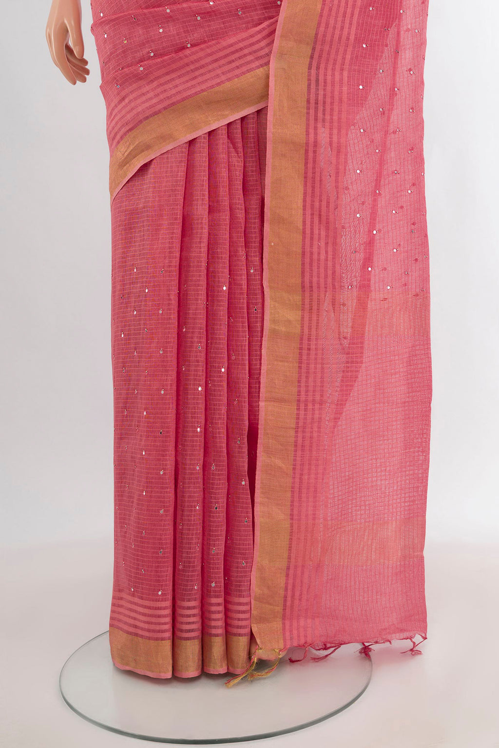 Pleats and pallu of Rose pink Tussar Silk Saree with Embroidery on the body and Zari Border. 