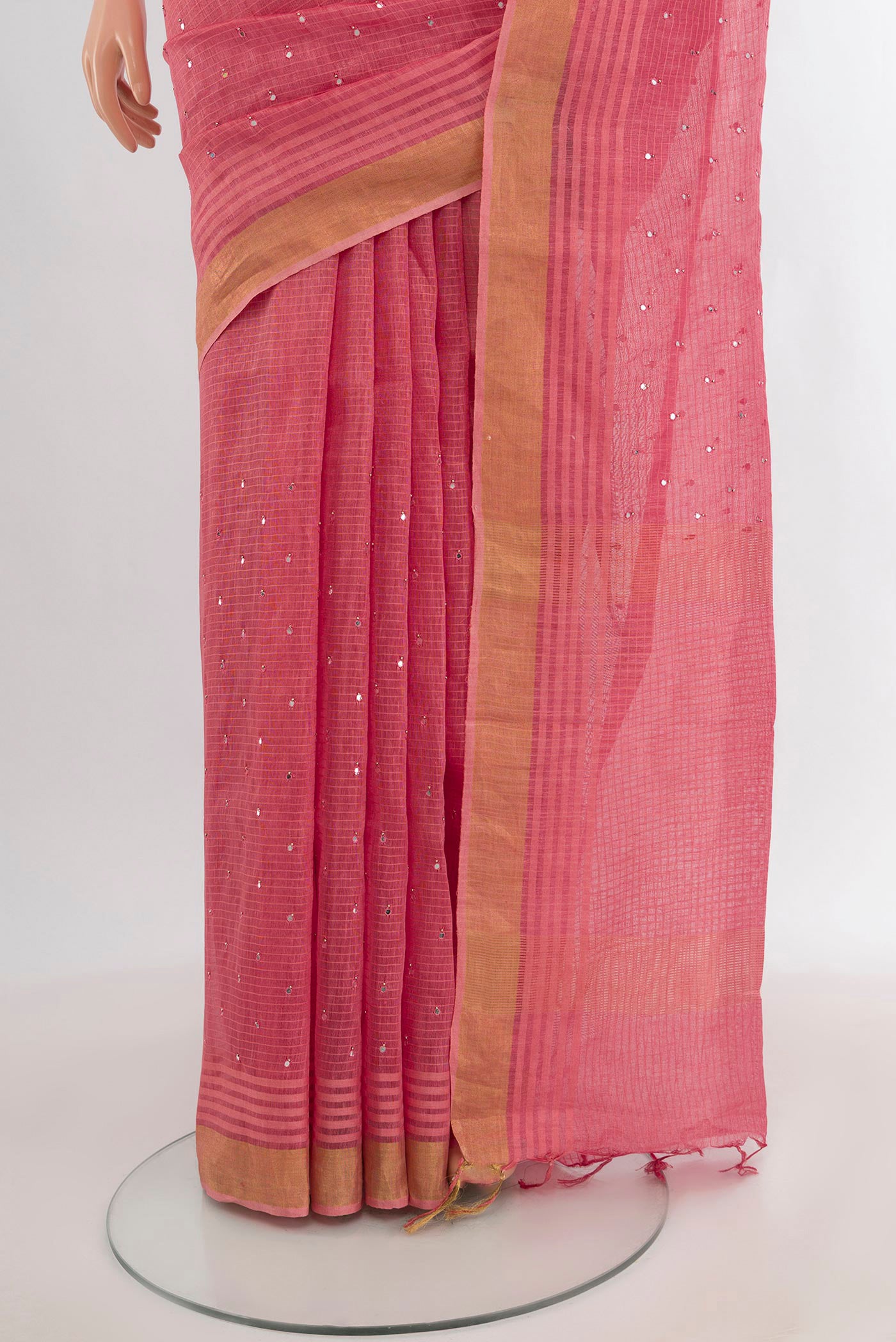 Pleats and pallu of Rose pink Tussar Silk Saree with Embroidery on the body and Zari Border. 