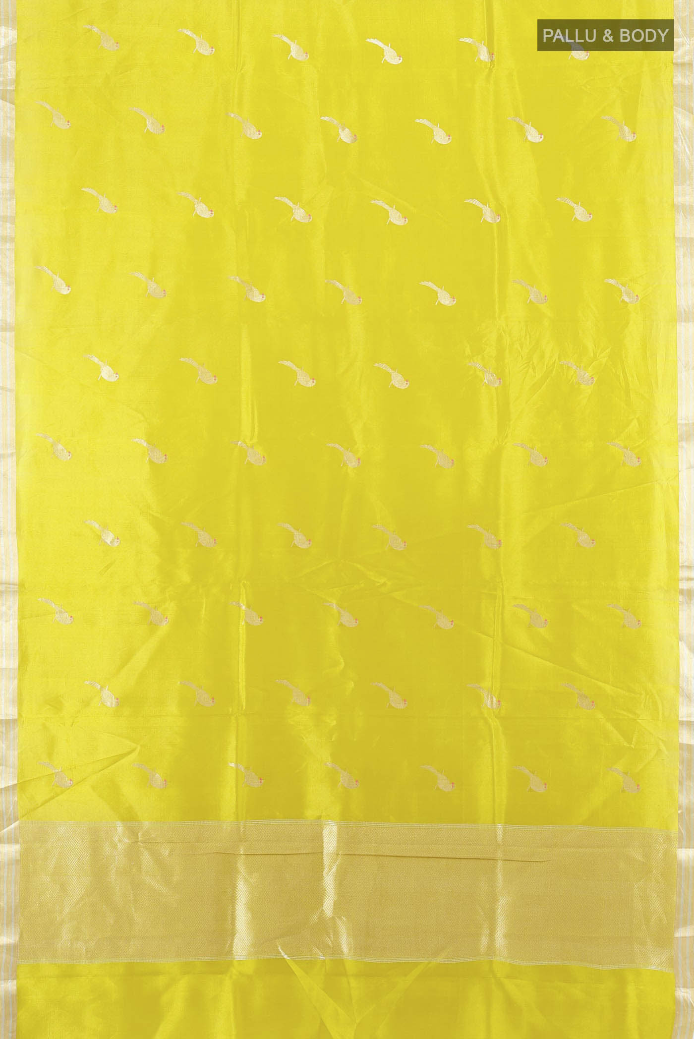 Flat view of Pista Green Banarasi Katan Silk Saree with Zari Butta on the body and Silk Border. 