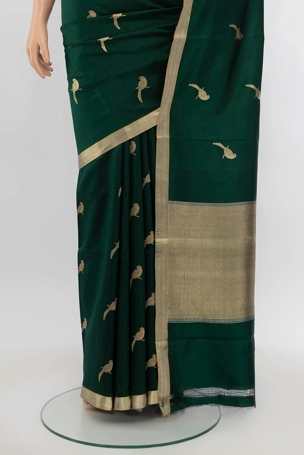 Pleats and pallu of Bottle Green Banarasi Katan Silk Saree with Zari Butta on the body and Silk Border. 