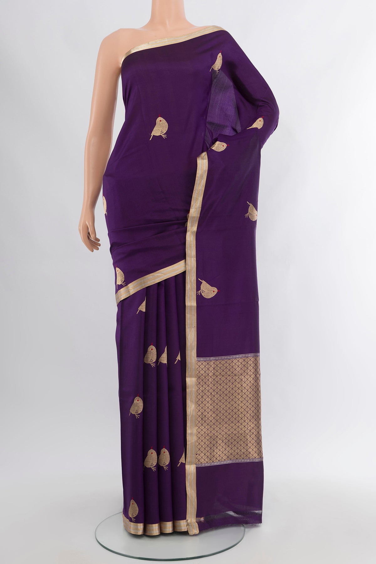 Violet Banarasi Katan Silk Saree with Zari Butta on the body and Zari Border.  displayed on a mannequin
