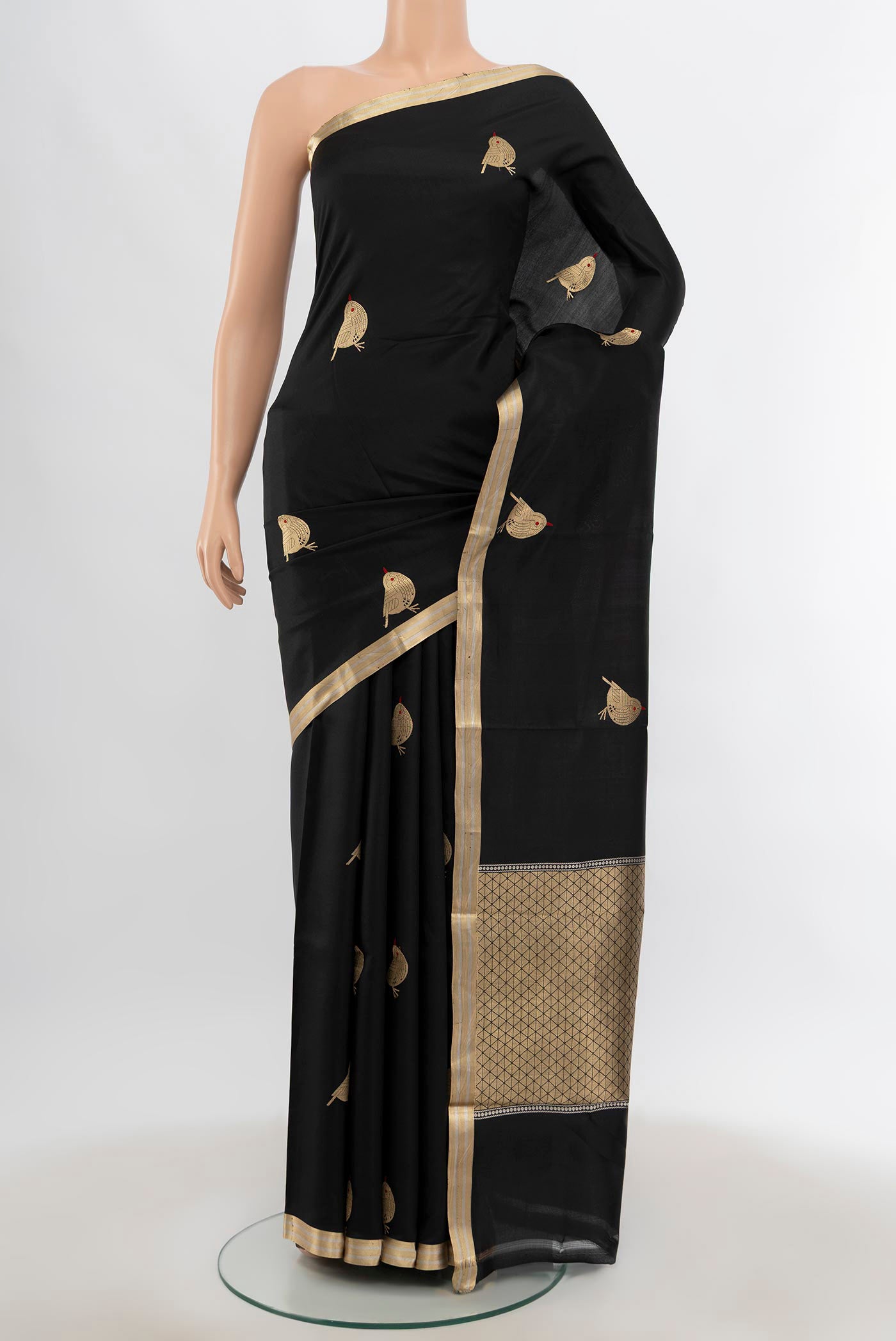 Black Banarasi Katan Silk Saree with Zari Butta on the body and Silk Border.  displayed on a mannequin