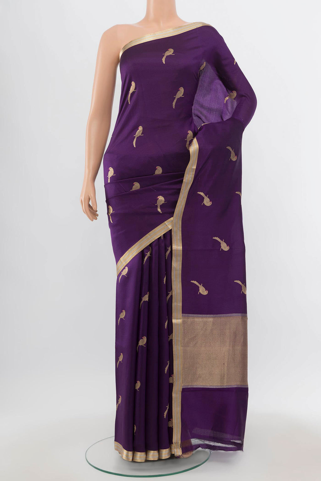 Purple Banarasi Katan Silk Saree with Zari Butta on the body and Zari Border.  displayed on a mannequin