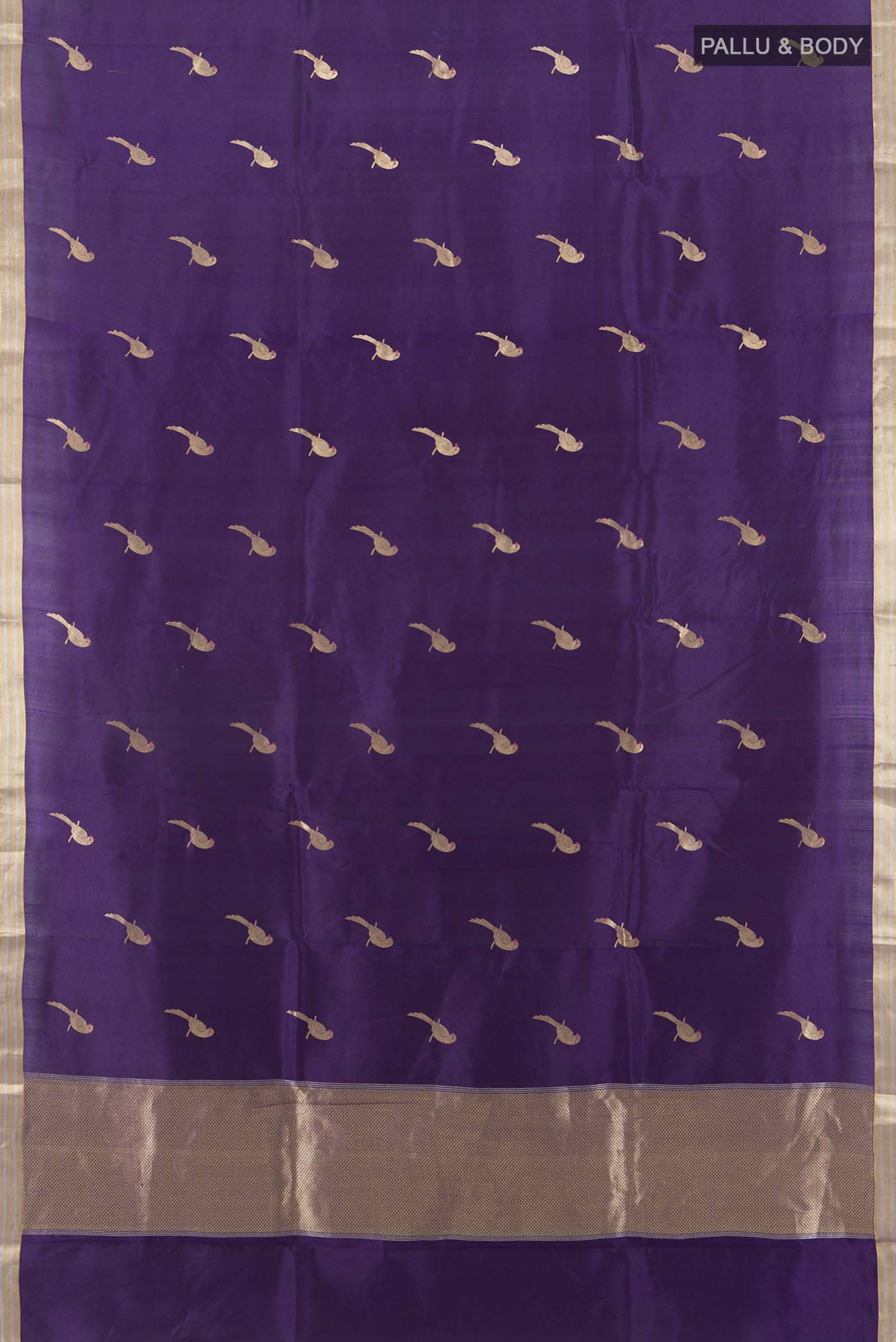 Flat view of Purple Banarasi Katan Silk Saree with Zari Butta on the body and Zari Border. 