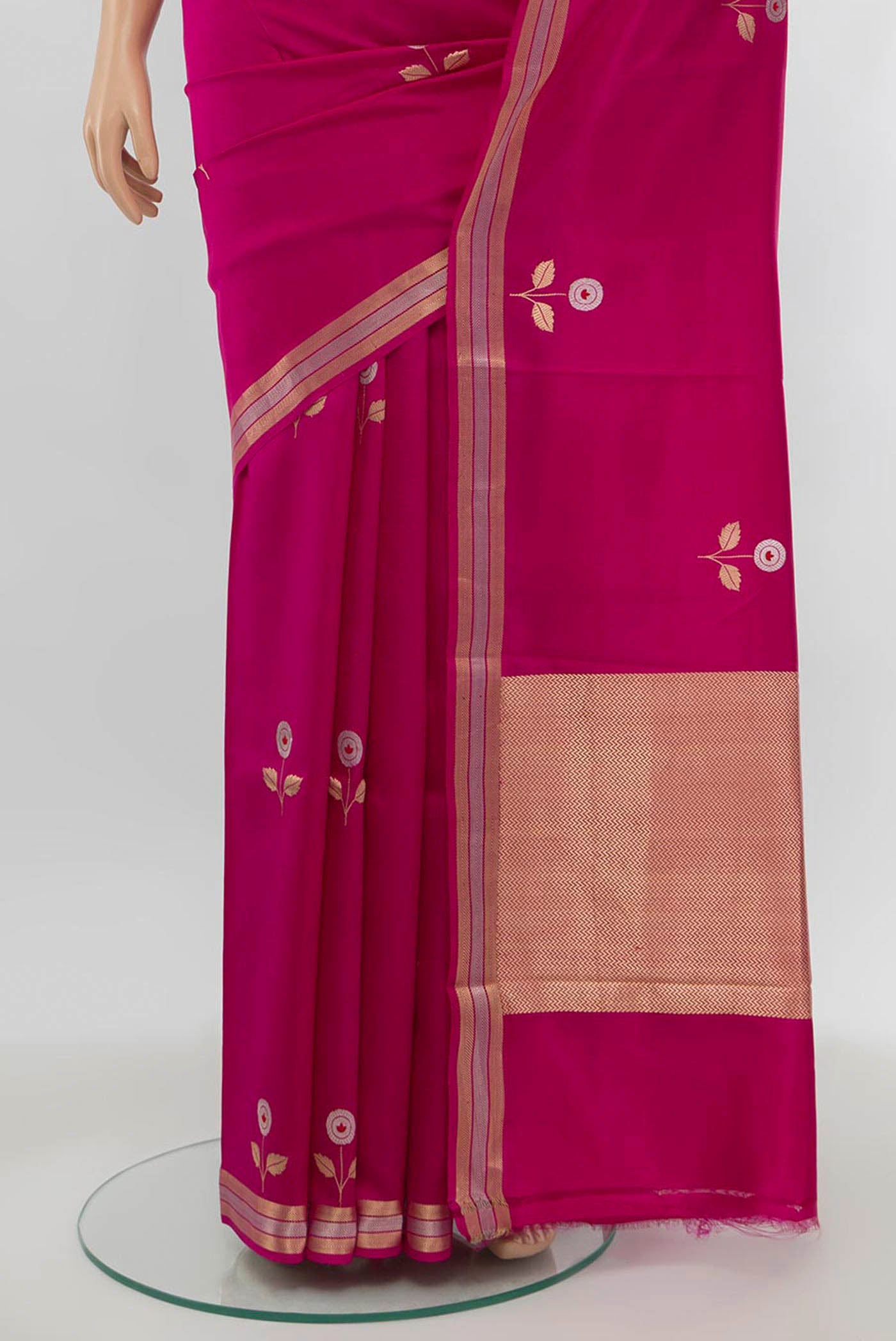 Pleats and pallu of Rani Pink Banarasi Katan Silk Saree with Zari Butta on the body and Silk Border. 