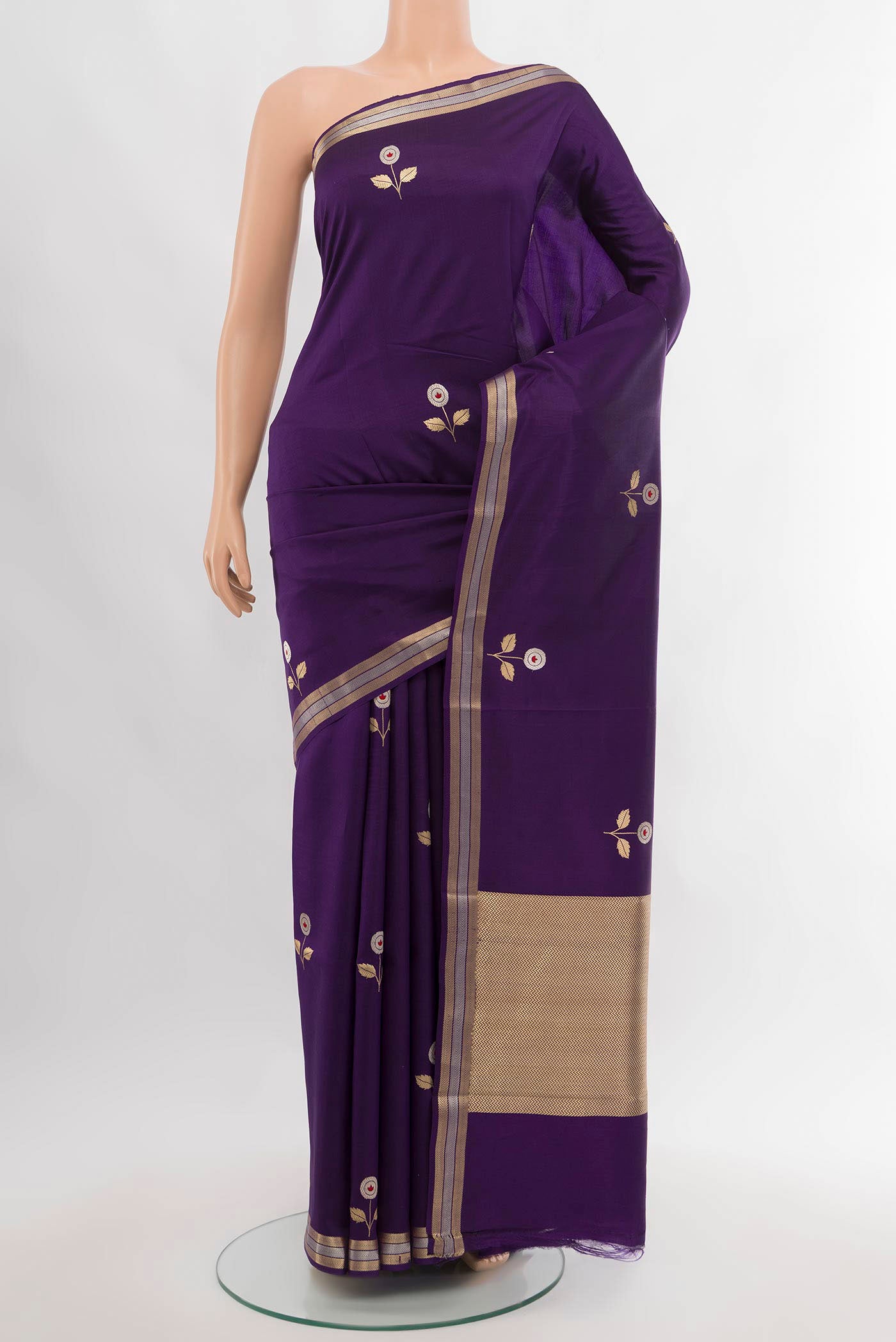Violet Banarasi Katan Silk Saree with Zari Butta on the body and Silk Border.  displayed on a mannequin