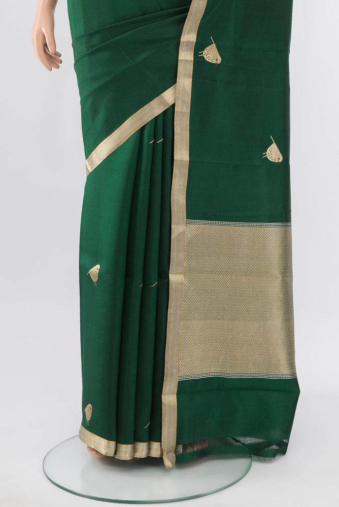 Pleats and pallu of Bottle Green Banarasi Katan Silk Saree with Zari Butta on the body and Silk Border. 
