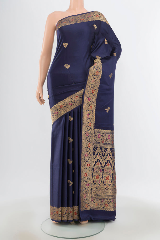 Pure Silk Pure Zari Navy Blue Banarasi Katan Saree with Zari Butta on the body and Silk Border.  displayed on a mannequin