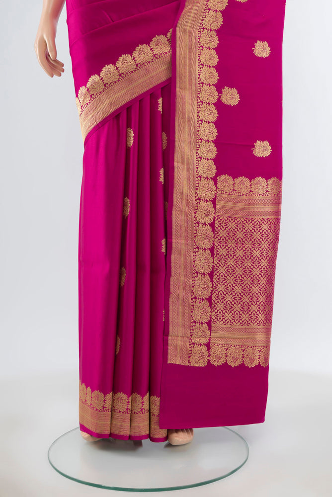Pleats and pallu of Pure Silk Pure Zari Dark Pink Banarasi Katan Saree with Zari Butta on the body and Silk Border. 