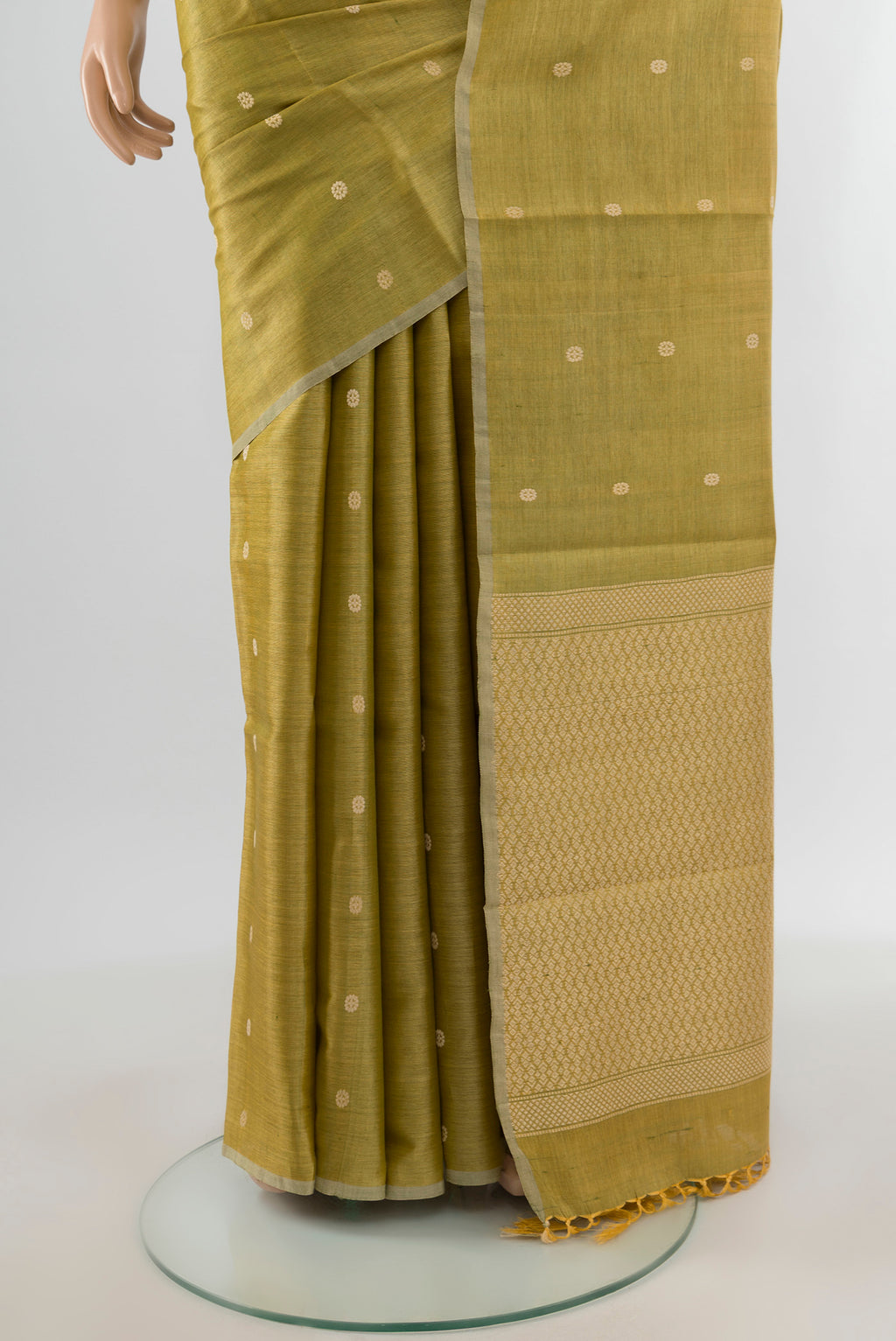 Pleats and pallu of Golden Tussar Silk Saree with Zari Butta on the body and Zari Border. 