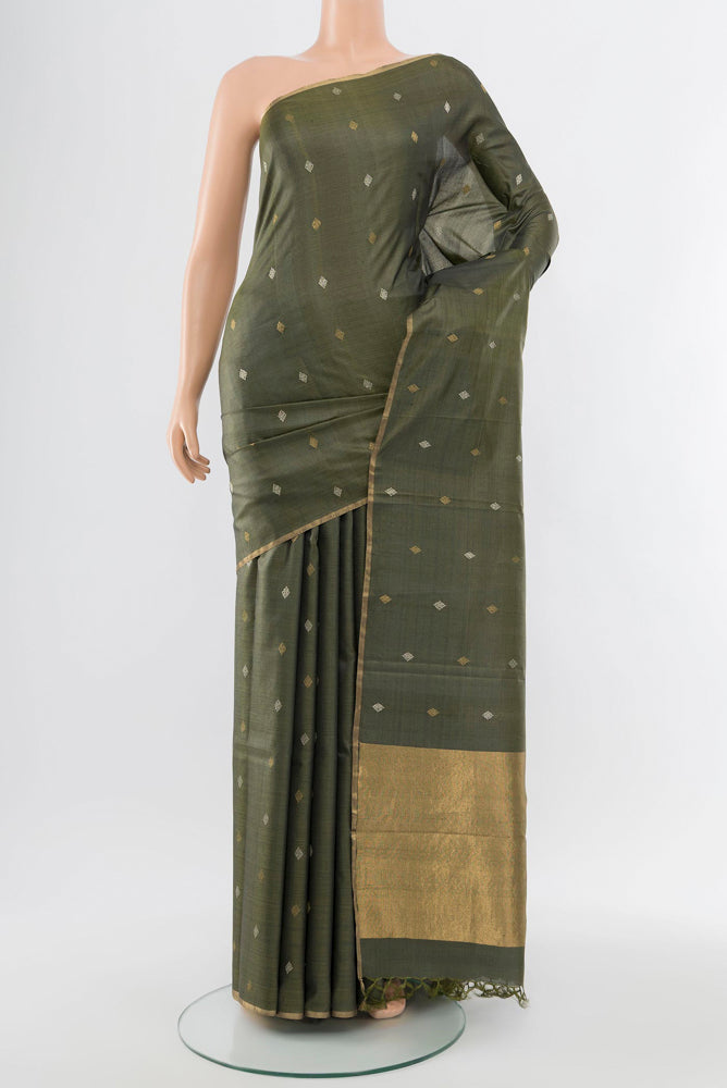 Multi Color Tussar Silk Saree with Zari Butta on the body and Silk Border.  displayed on a mannequin