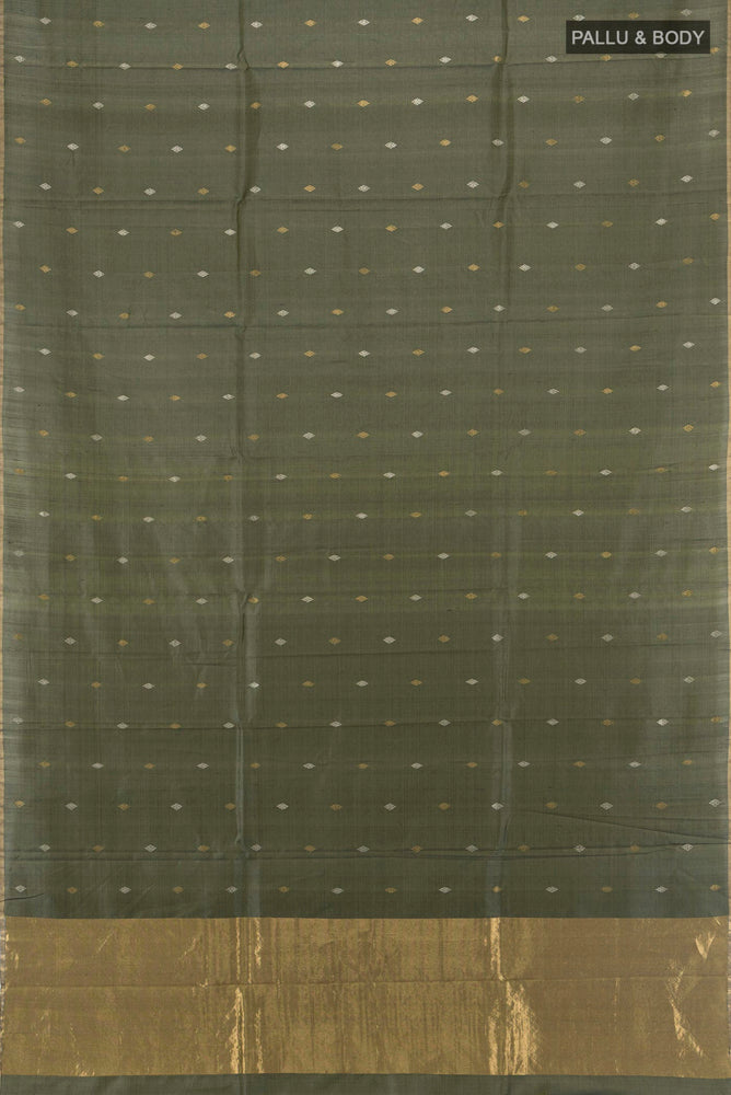 Flat view of Multi Color Tussar Silk Saree with Zari Butta on the body and Silk Border. 