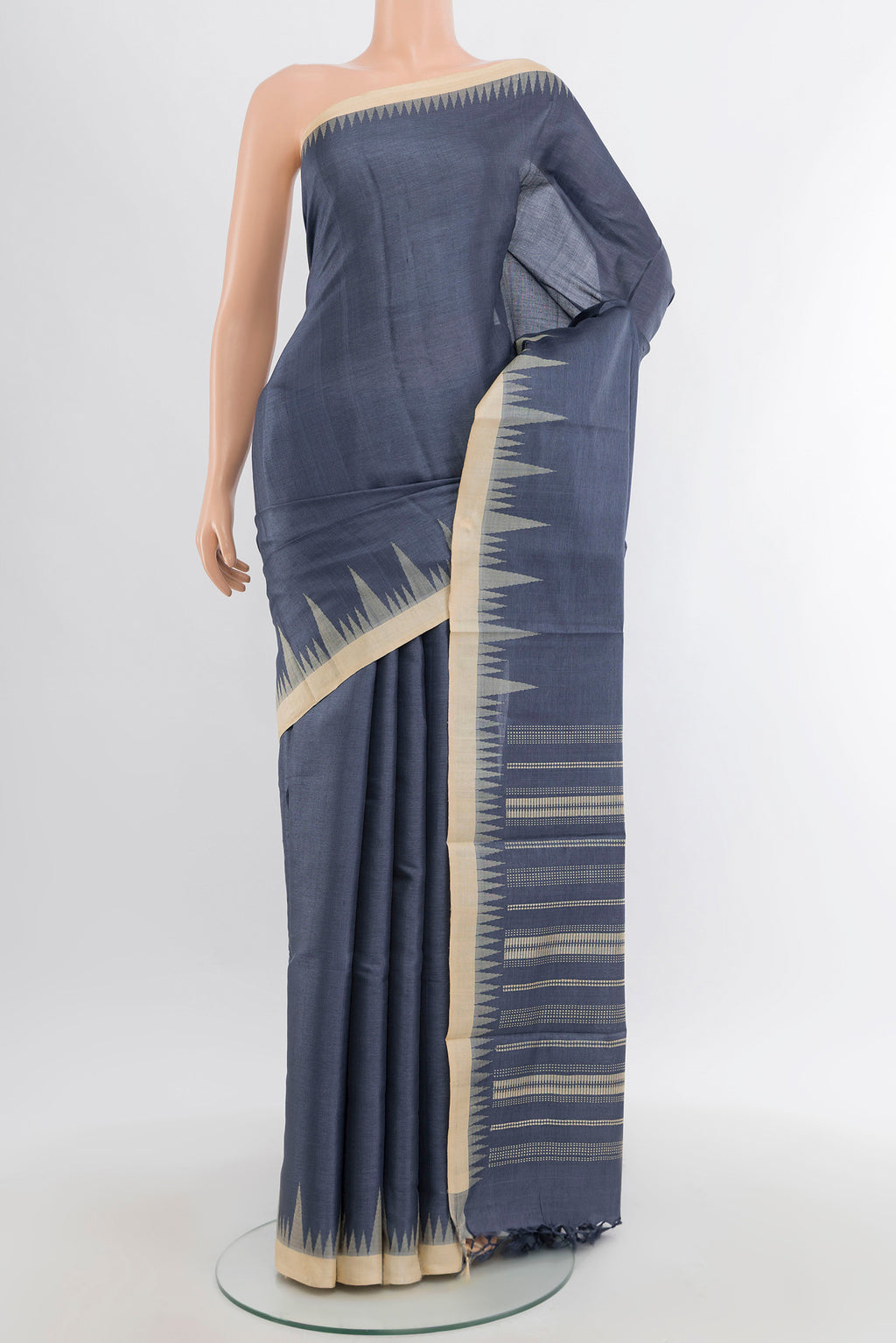 Navy Blue Tussar Silk Saree with Plain Body and Temple Border.  displayed on a mannequin