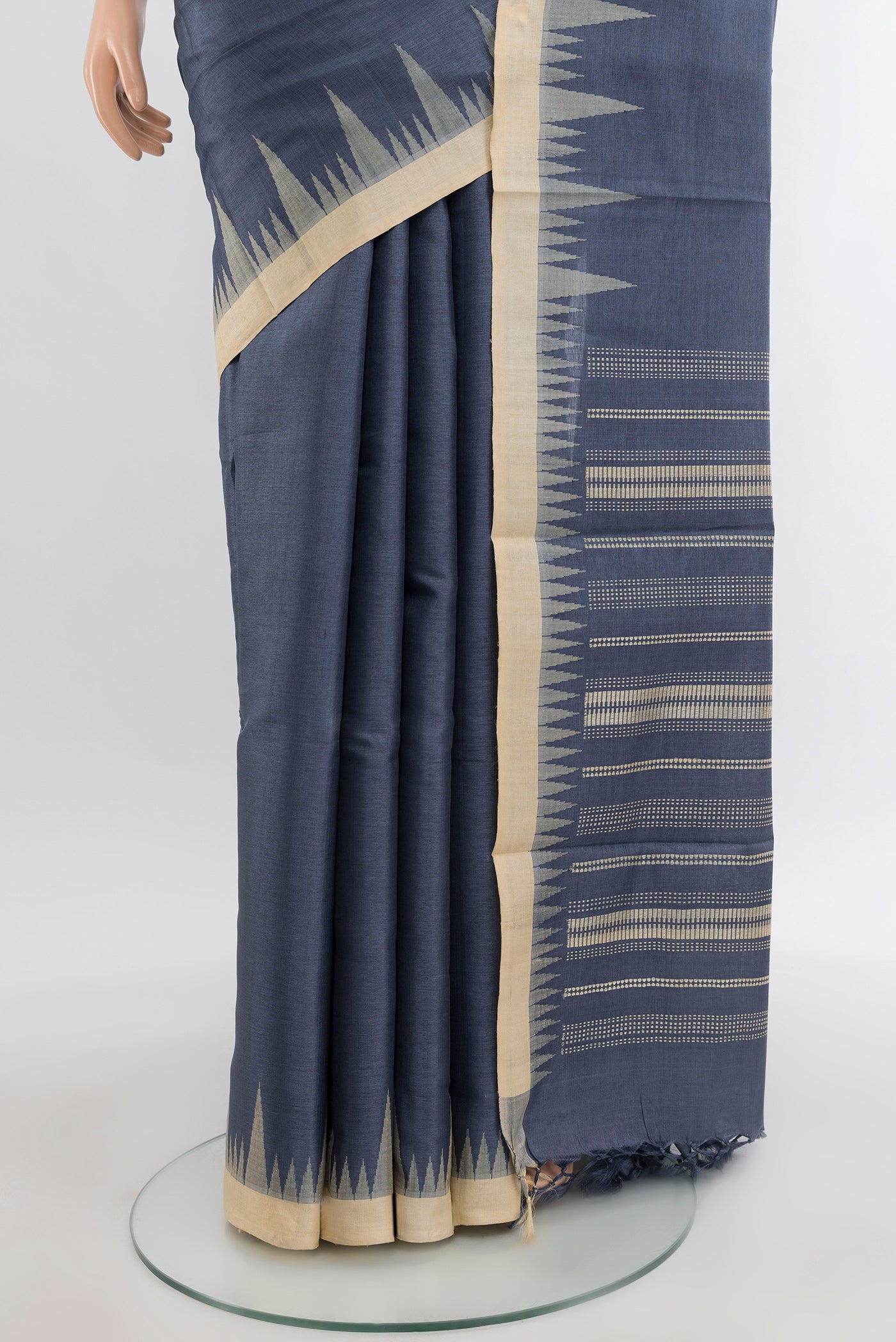 Pleats and pallu of Navy Blue Tussar Silk Saree with Plain Body and Temple Border. 
