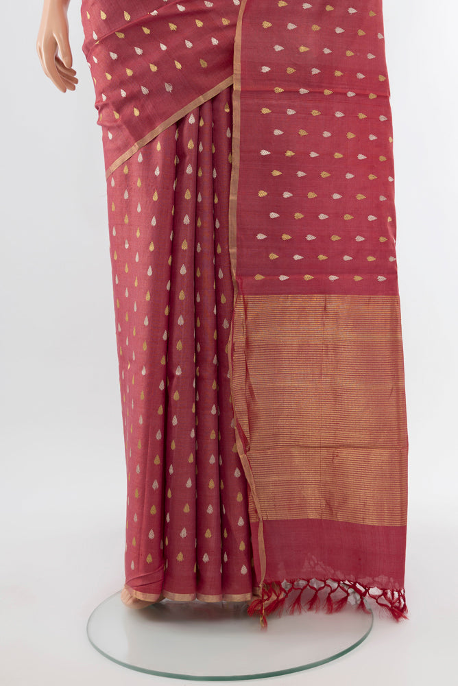 Pleats and pallu of Bronze Tussar Silk Saree with Zari Butta on the body and Silk Border. 