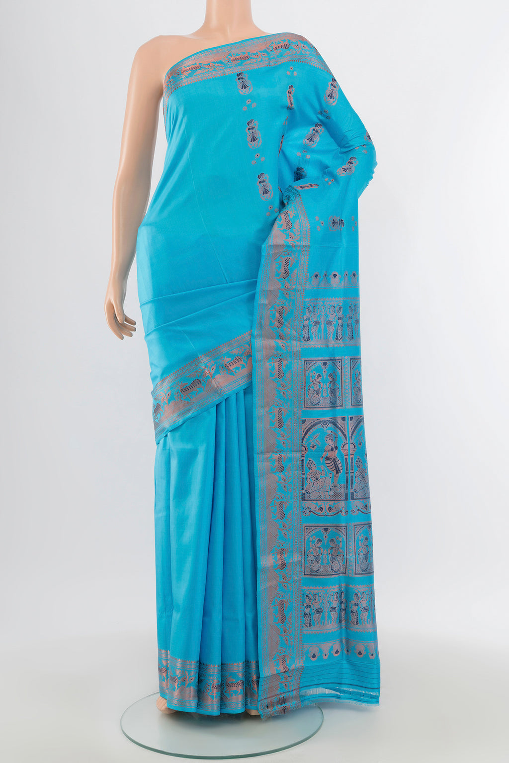 Light Blue Baluchari Silk Saree with Zari And Thread Butta on the body and Zari Border.  displayed on a mannequin