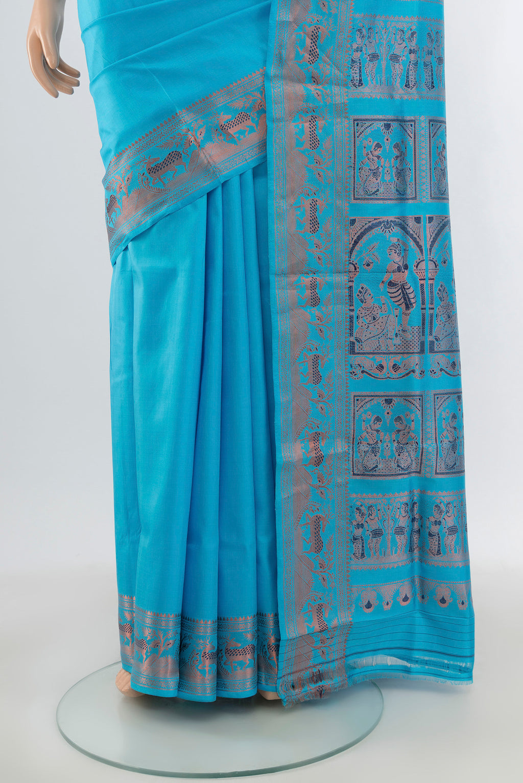 Pleats and pallu of Light Blue Baluchari Silk Saree with Zari And Thread Butta on the body and Zari Border. 