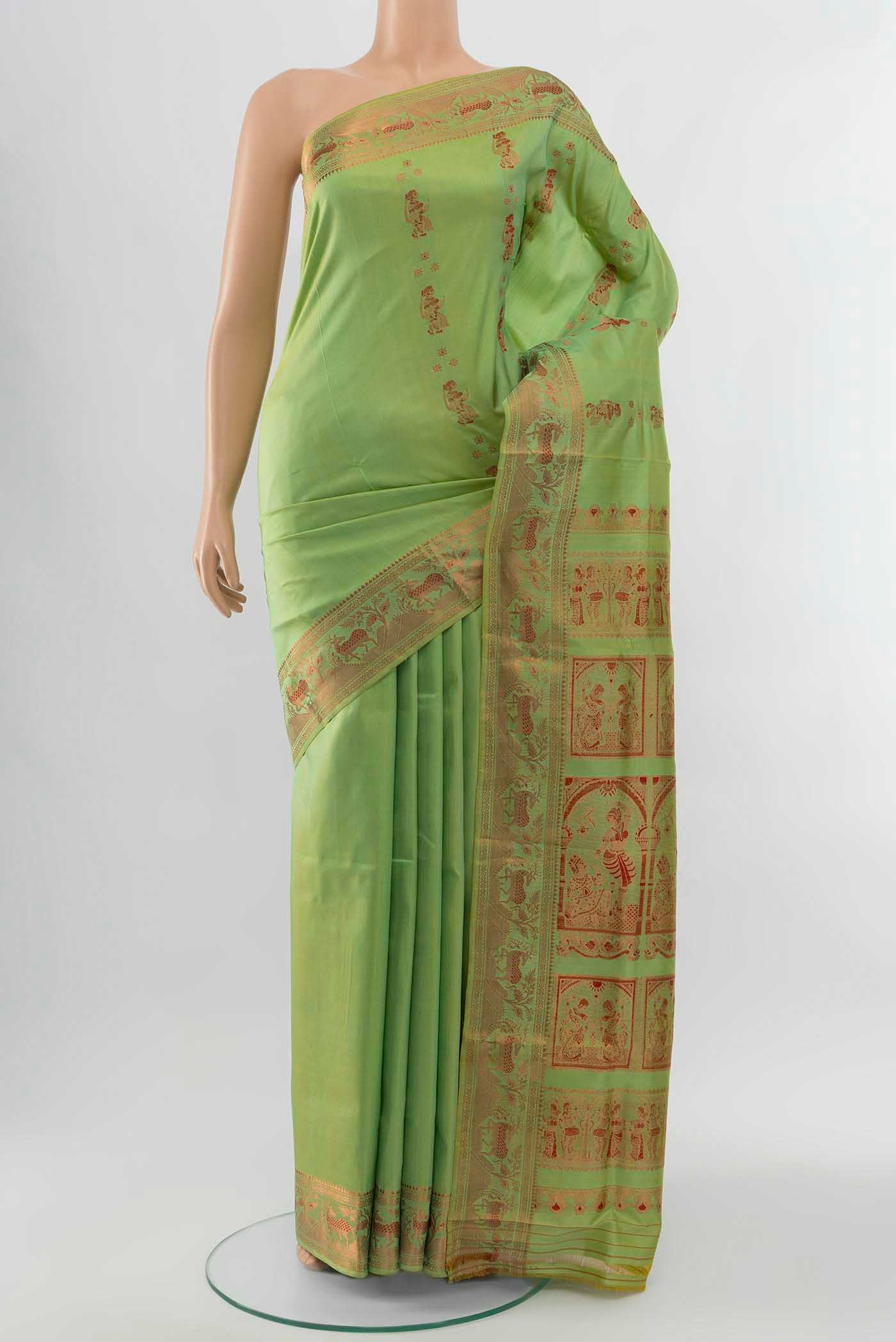 Pista Green Baluchari Silk Saree with Zari Brocade on the body and Silk Border displayed on a mannequin