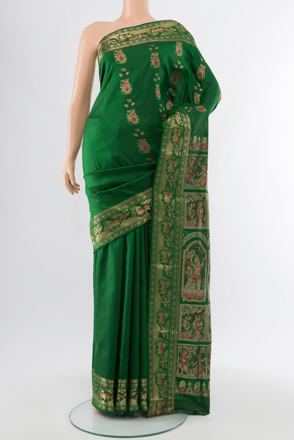 Bottle Green Baluchari Silk Saree with Zari Butta on the body and Silk Border.  displayed on a mannequin