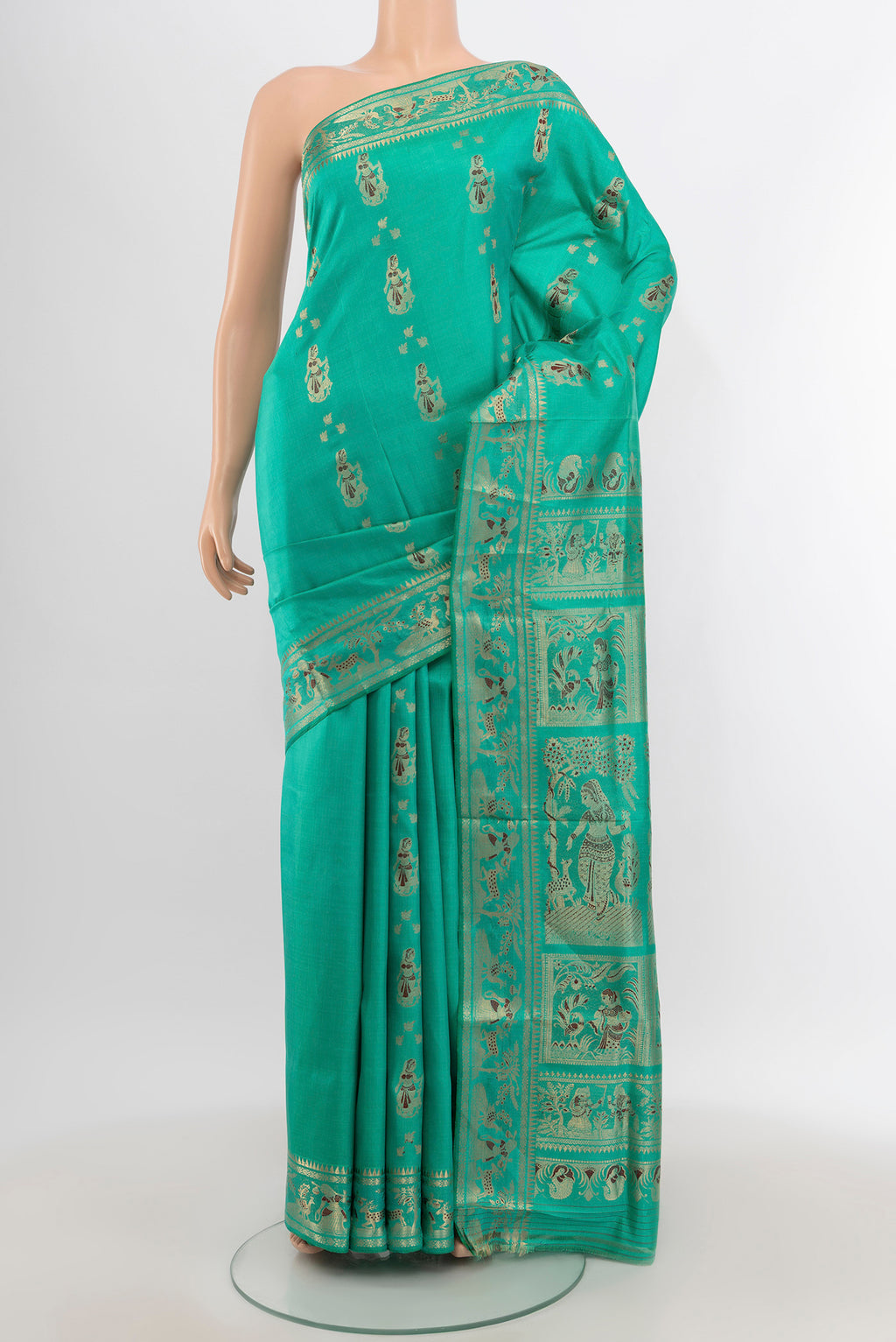 Turquoise Baluchari Silk Saree with Zari And Thread Butta on the body and Zari Border.  displayed on a mannequin