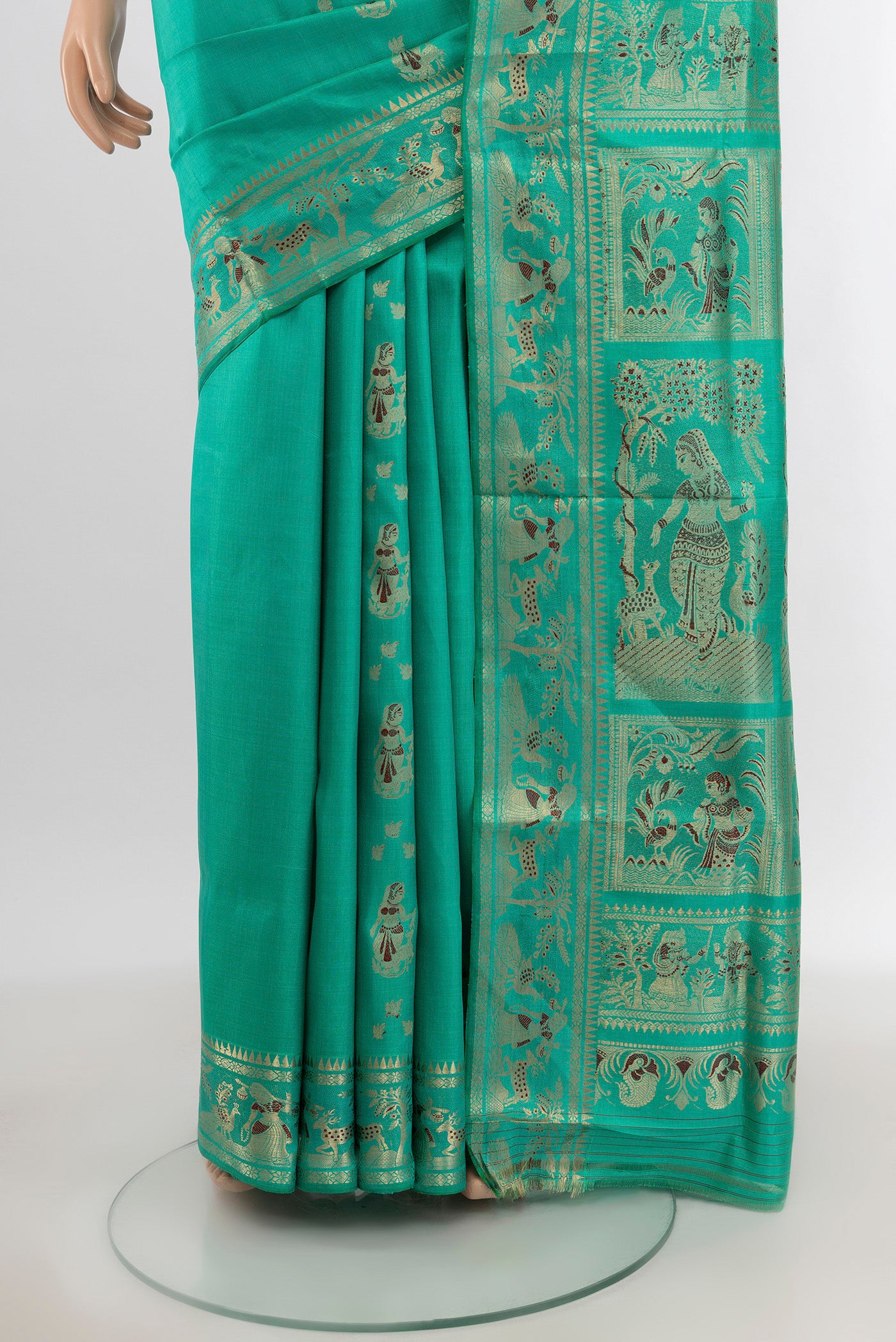 Pleats and pallu of Turquoise Baluchari Silk Saree with Zari And Thread Butta on the body and Zari Border. 