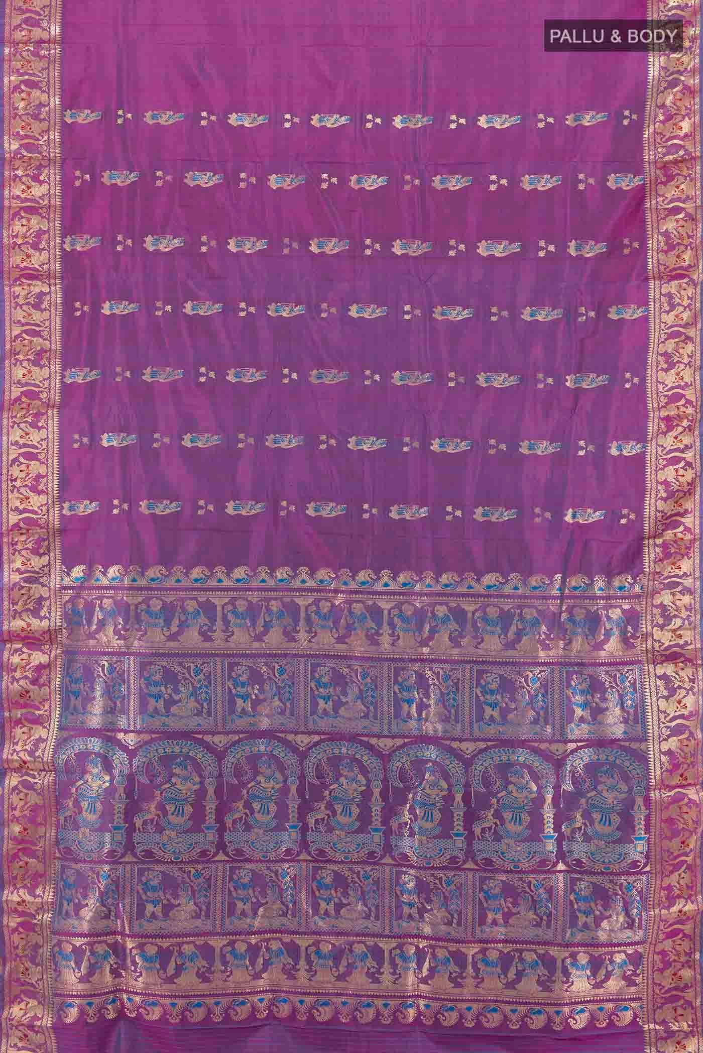 Flat view of Purple Baluchari Silk Saree with Zari Butta on the body and Silk Border. 