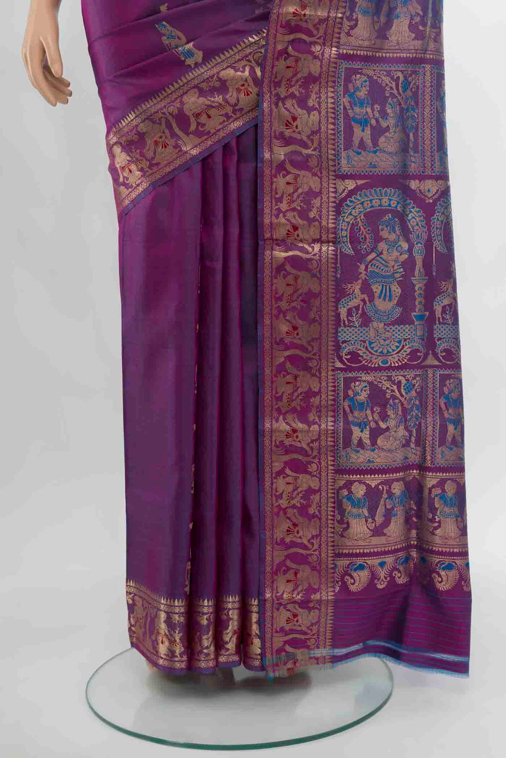 Pleats and pallu of Purple Baluchari Silk Saree with Zari Butta on the body and Silk Border. 