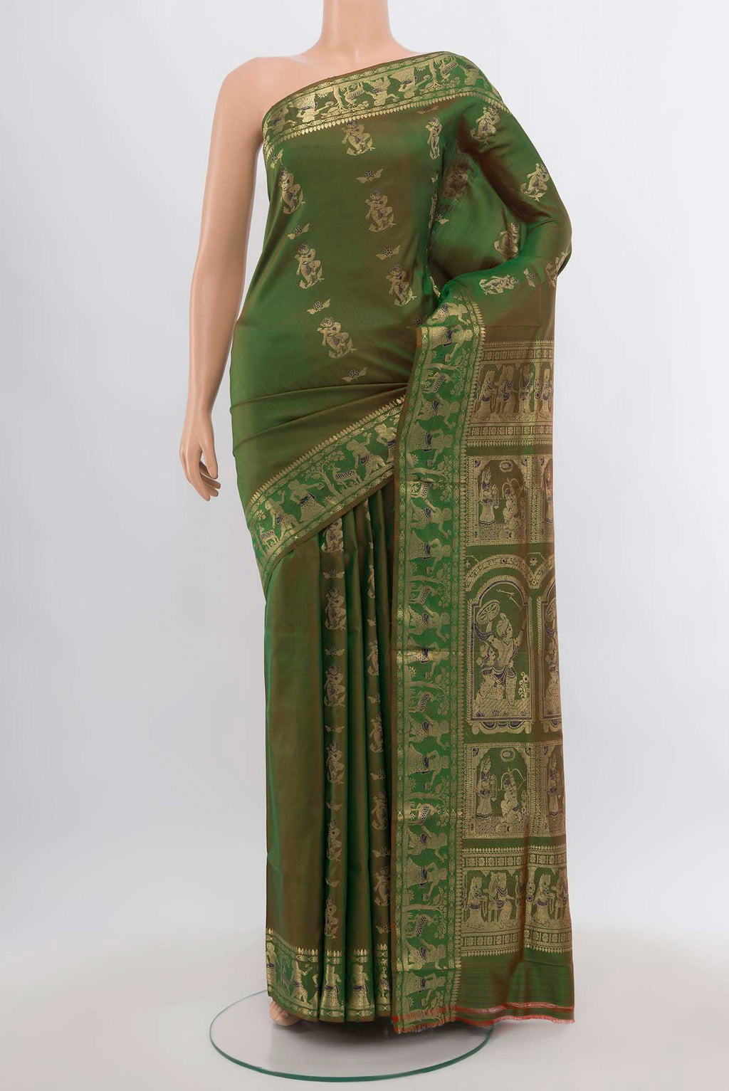 Mehandi Green Baluchari Silk Saree with Zari Butta on the body and Silk Border.  displayed on a mannequin